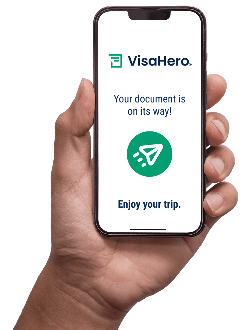 Phone in hand showing VisaHero app with document processing status
